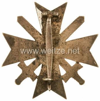 War Merit Cross I Class with Swords, by C. E. Juncker (L/12, tombac) Reverse