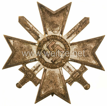 War Merit Cross I Class with Swords, by C. E. Juncker (L/12, tombac) Obverse