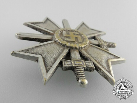 War Merit Cross I Class with Swords, by C. E. Juncker (L/12, tombac, screwback) Obverse